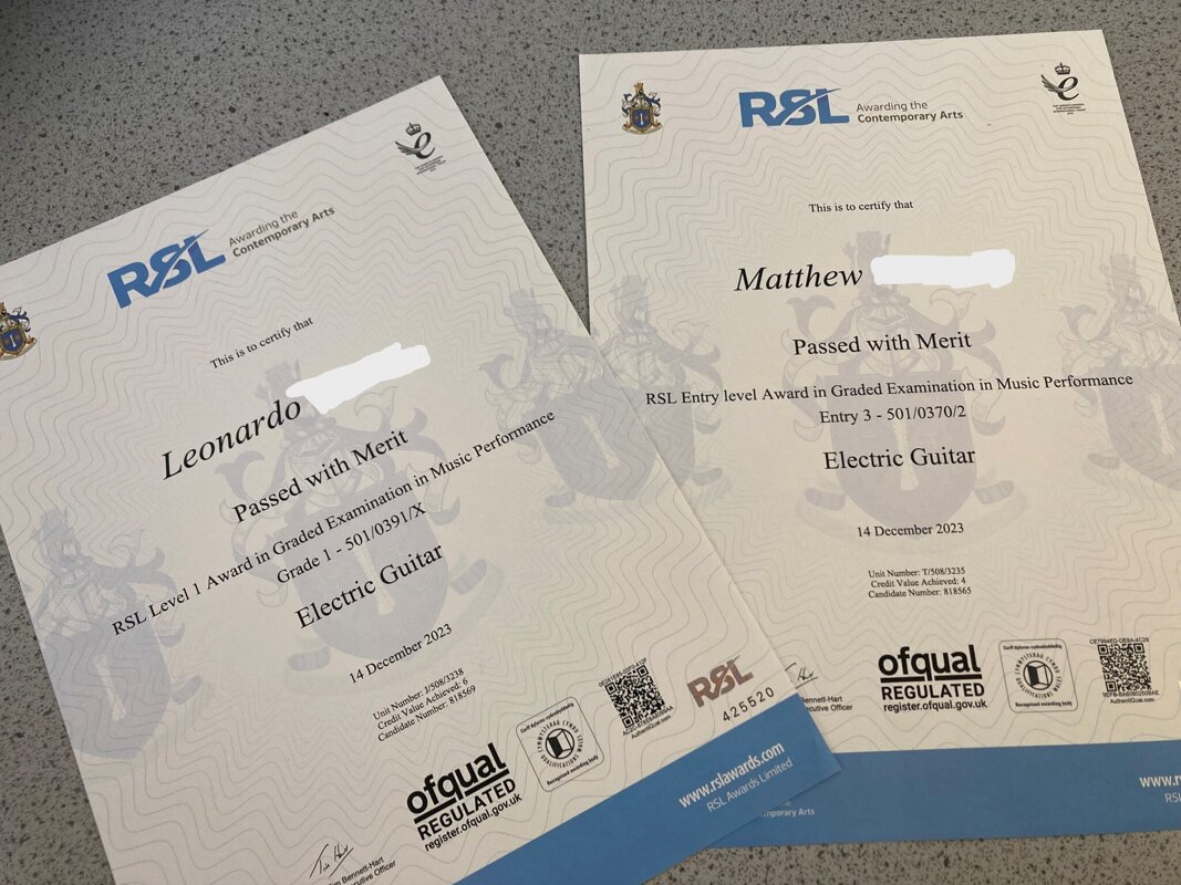 Image of Congratulations to two pupils on passing their electric guitar exams